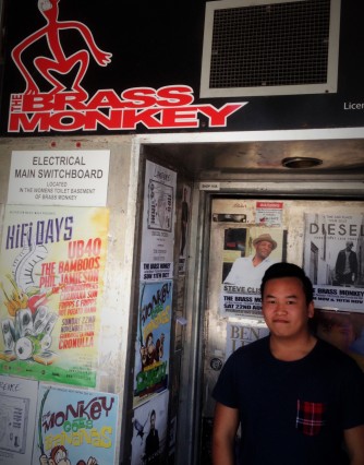 Fripps and Fripps' member, Michael Tran, standing in the entrance way of the Brass Monkey.